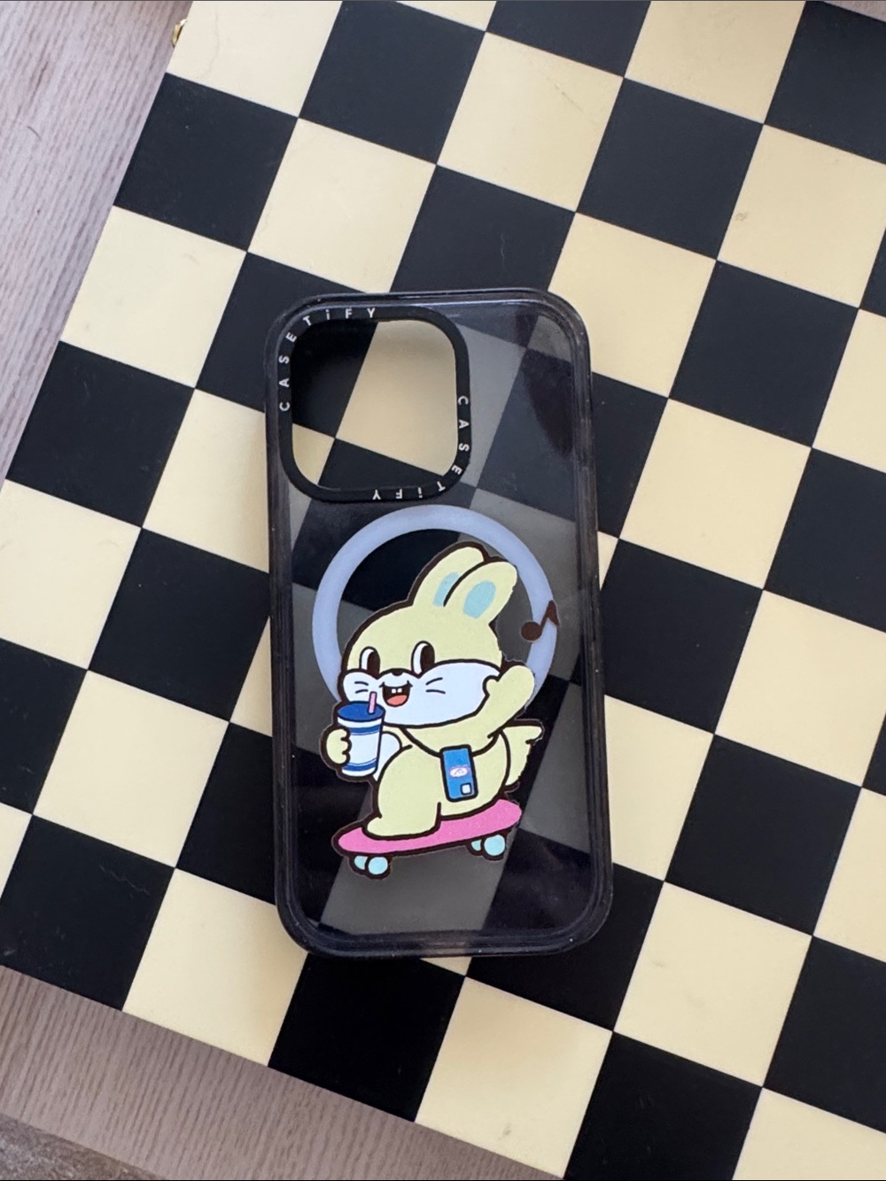 Casetify Black Speckle Clear Phone Case with Yellow Bunny on Pink Skateboard